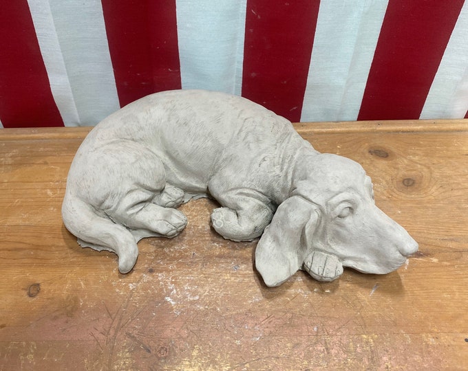 Laying dachshund dog concrete statue garden decor