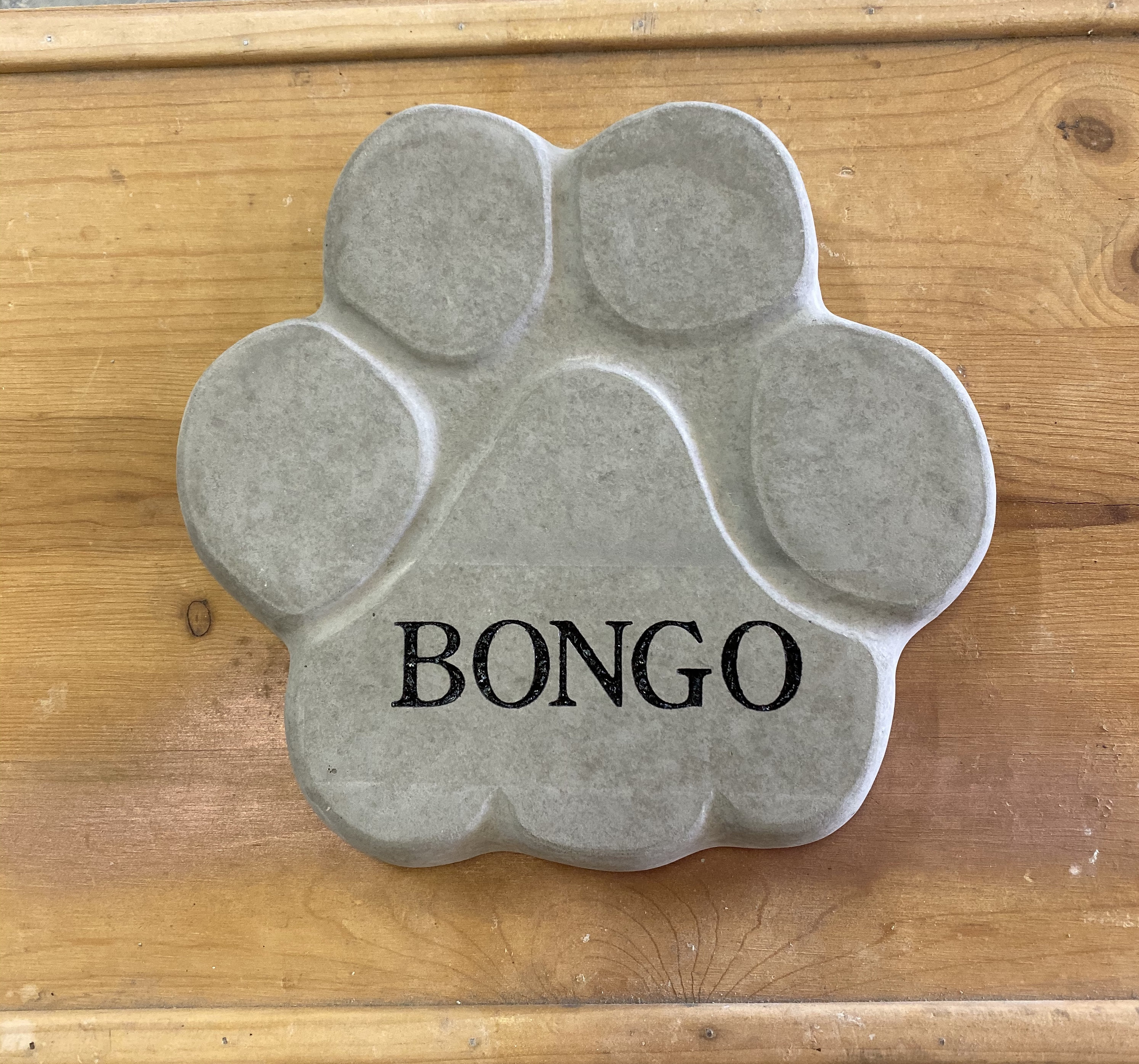 Custom engraved concrete paw print