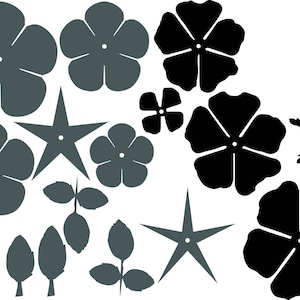 May include: A set of black and grey paper flower cut-outs. The flowers are in various shapes and sizes, including five-petal flowers, four-petal flowers, and star shapes.