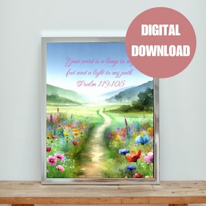 Może przedstawiać: Akwarela przedstawiająca ścieżkę prowadzącą przez pole dzikich kwiatów. Tekst "Your word is a lamp to my feet and a light to my path. Psalm 119:105" jest napisany różowym kolorem na tle niebieskiego nieba.