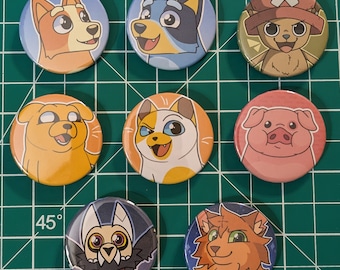 May include: Nine colorful round buttons with cartoon animal illustrations. The buttons feature a variety of animals, including a dog, a cat, a pig, a fox, and a wolf. The buttons are perfect for adding a touch of whimsy to any project.
