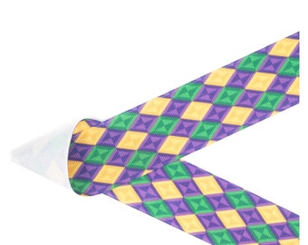 May include: Purple, yellow, and green patterned ribbon with a geometric design. The ribbon is folded in half, showing the back side of the ribbon.