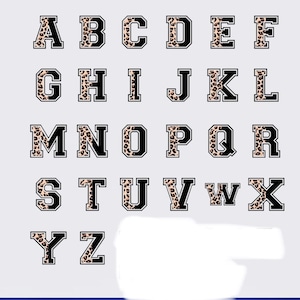 May include: A set of uppercase letters A through Z with a leopard print pattern inside each letter. The letters are black with a white outline.