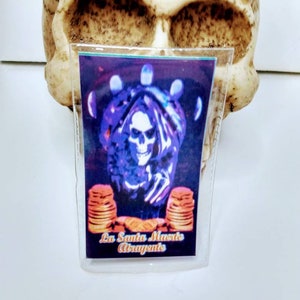 Laminated Santa Muerte prayer card. La Santa Muerte atrayente (attractive)
