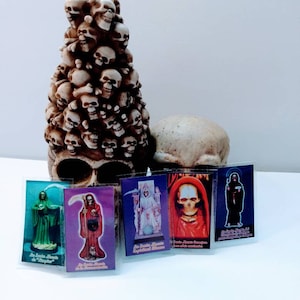 Santa Muerte laminated 1.5x3 inch prayer card with oraciones.
