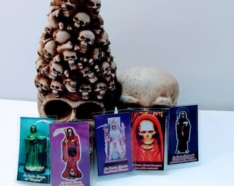 Santa Muerte laminated 1.5x3 inch prayer card with oraciones.