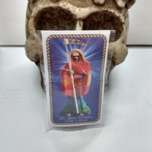ラミネート加工されたサンタ ムエルテの祈りカード。 La Unica verdadera Santa Muerte (唯一の真の聖人)