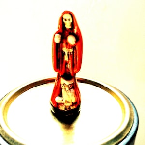 Santa Muerte Holy death orange statue about 3 inches prepared