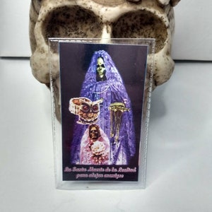 Laminated Santa Muerte prayer card. La Santa Muerte de la lealtad para alejar enemigos