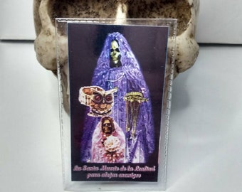 Laminated Santa Muerte prayer card. La Santa Muerte de la lealtad para alejar enemigos