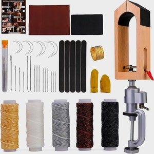 May include: Leather craft tool kit with a wooden stand, a clamp, needles, thread, thimbles, and a piece of leather.  The kit also includes instructions for installation and use.