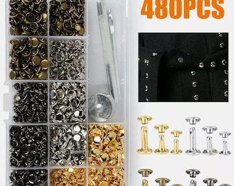 May include: A clear plastic organizer box filled with various metal rivets in gold, silver, and black finishes. Includes a setting tool and a sample of rivets on a black garment. The text "480PCS" is displayed.