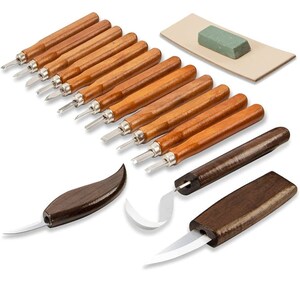 May include: A set of 15 wood carving tools with wooden handles. The set includes a variety of blades, including a hook knife, a gouge, and a skew chisel. The set also includes a sharpening stone and a leather strop.