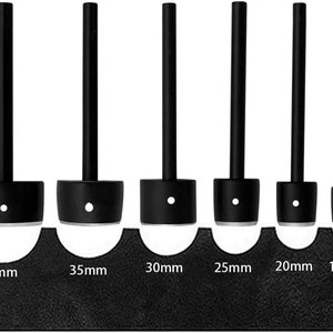 May include: Six black leather hole punch tools with different sizes: 40mm, 35mm, 30mm, 25mm, 20mm, and 15mm. The tools are arranged from largest to smallest.