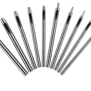 May include: Set of 10 silver metal hole punch tools with different sized holes. The tools are arranged in a fan shape.