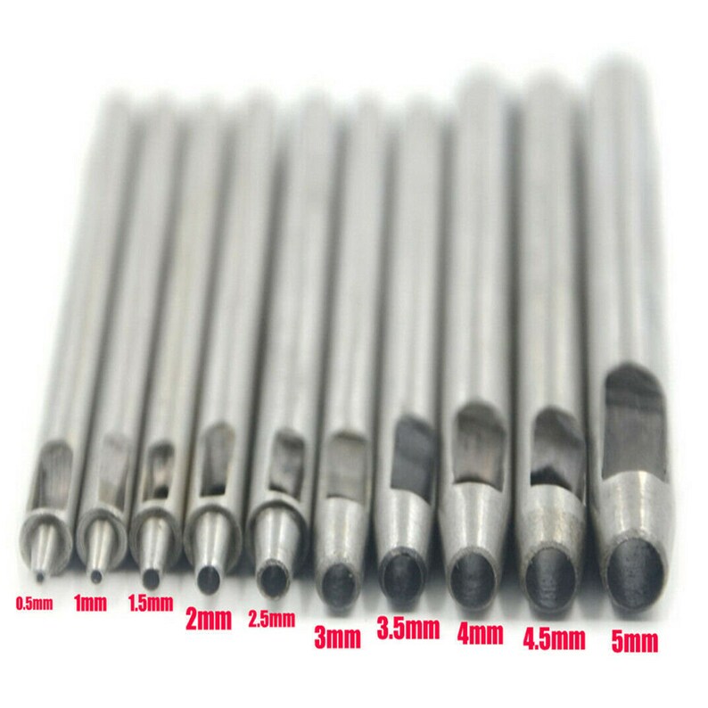 May include: Set of 10 silver metal hole punch tools with different sizes, ranging from 0.5mm to 5mm. The tools are arranged in order of size, with the smallest on the left and the largest on the right.