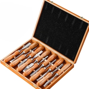 May include: A set of ten wood carving chisels with wooden handles, in a wooden box with a black foam interior.