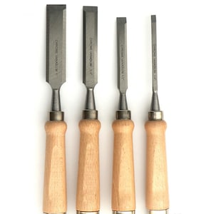 May include: Set of four wood handled chisels with chrome vanadium blades. The blades are labeled 1/4", 1/2", 3/4", and 1".