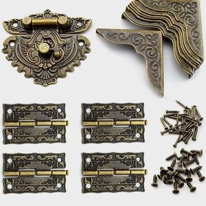 May include: Set of antique brass hardware for furniture, including a decorative latch, four hinges, and a selection of screws and nails.