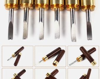 May include: Set of six leather crafting tools with wooden handles and gold-colored metal tips. The tools are shown in various positions, including a close-up of the tips.