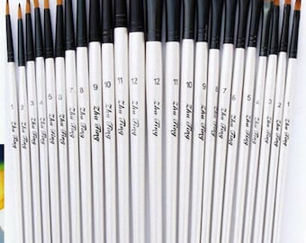 May include: A set of 22 paint brushes with white handles and black ferrules. The brushes are numbered 1 through 12, with the larger numbers indicating larger brush sizes. The brushes are arranged in order of size, with the smallest brush on the right and the largest brush on the left.