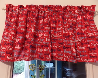 May include: Red fabric valance with white stars and the words "Brave", "Honor", "Courage", "Service", "Valor", and "Thank You" repeated in a pattern.