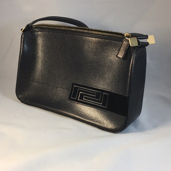 A 1990’s vintage Versace black leather handbag.