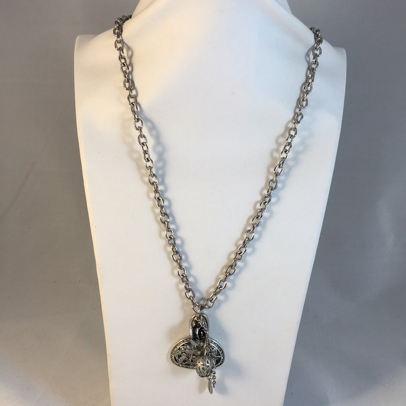 Necklace for women Charm necklace. Signed Mango Vintage silver tone chain necklace with assorted complimentary silver tone pendants