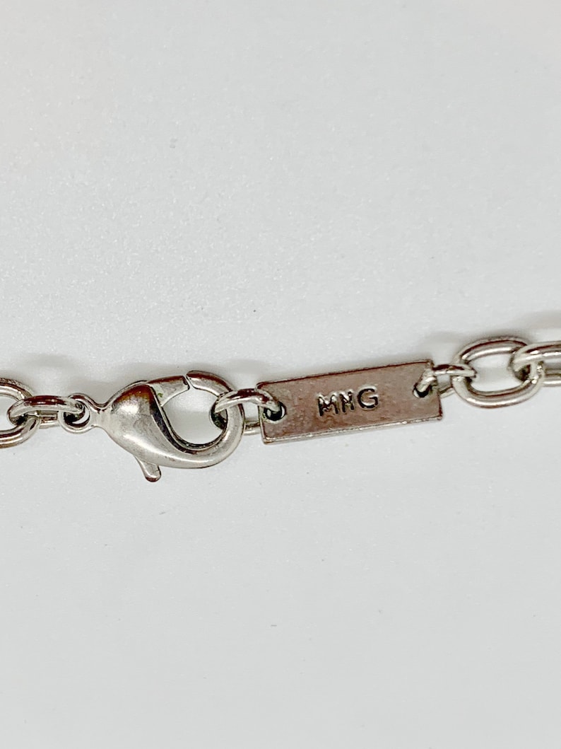 Necklace for women Charm necklace. Signed Mango Vintage silver tone chain necklace with assorted complimentary silver tone pendants