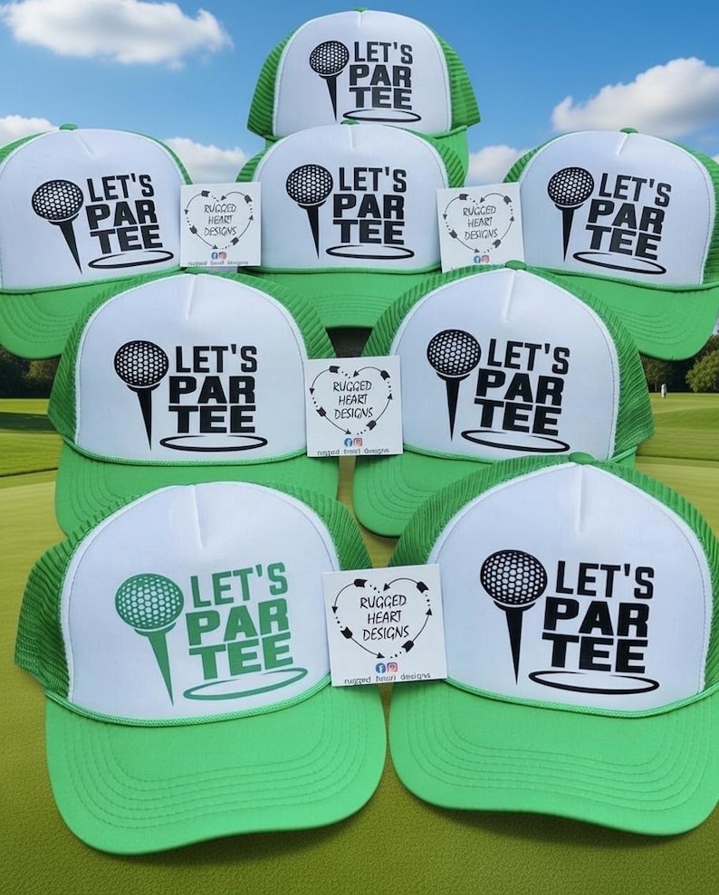 May include: A collection of green and white trucker hats. Each hat features the text "LET'S PAR TEE" with a golf ball and tee graphic. Small cards with the text "RUGGED HEART DESIGNS" are also present.