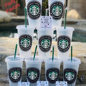 May include: Eight clear plastic cups with black and white designs that say "Officially Adulting Eighteen" with a Starbucks logo.  The cups are arranged in a circle with a sticker on each cup that says "Rugged Heart Designs".