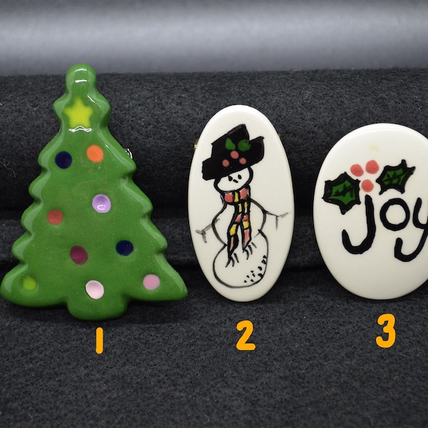 Hand painted ceramic pins. Christmas Tree, Snowman and Joy with Holly. Unique and one of a kind.