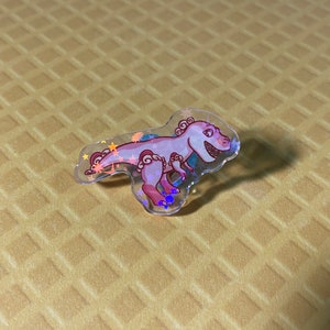 Candy Rex art accessory, unique acrylic T Rex pin for quirky fashion lovers, a perfect birthday gift for any dinosaur fan.