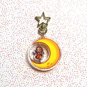 Sonne und Mond, die sich drehen, doppelseitiger Kindergarten-Begleiter Keychain