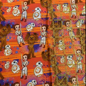 May include: Orange fabric with a repeating pattern of a female character from Star Wars, a furry creature, and a droid. The characters are in a cartoon style.