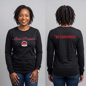 May include: A black long-sleeve shirt featuring the text Local Projects in red script on the front, along with a circular logo containing the Greek letters Delta Sigma Theta and the text Houston Alumnae Chapter. The back displays the text Do Something.