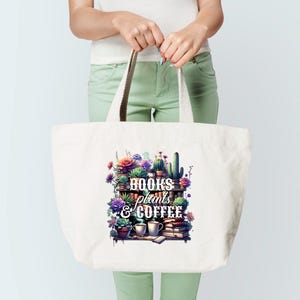 May include: A white tote bag with a colorful graphic of a shelf filled with plants, books, and coffee cups. The text "BOOKS plants & COFFEE" is displayed on the front. The bag has cream-colored handles.