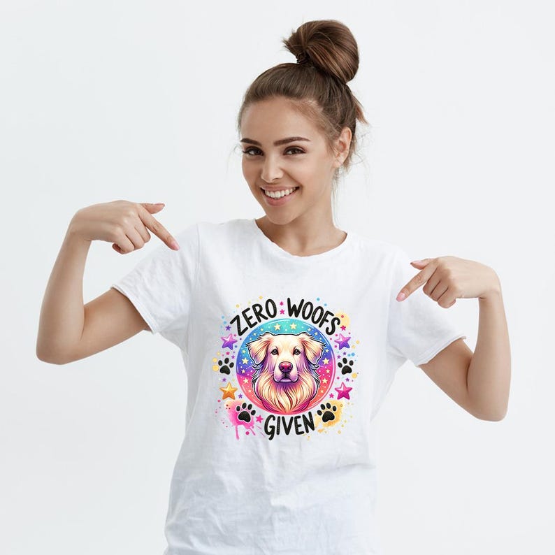 May include: White t-shirt with a colorful graphic of a dog's head and the text "Zero Woofs Given".