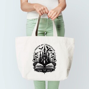 May include: A white canvas tote bag with a black graphic design featuring a castle, a dragon, and the text "I prefer my fairytales dark and spicy".