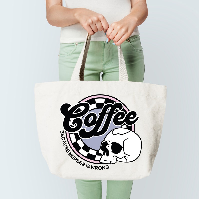 May include: White tote bag with a black and white graphic of a skull and the text "Coffee because murder is wrong".