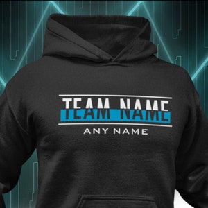 May include: Black hoodie with a white text overlay that says "TEAM NAME" with a blue stripe underneath and "ANY NAME" below the stripe.