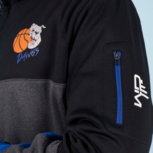 May include: Black and gray color block sweatshirt with a zippered pocket on the sleeve. The sweatshirt has a graphic of a bulldog with a basketball and the text "DAWGS". The sleeve also has a white "NF" logo.