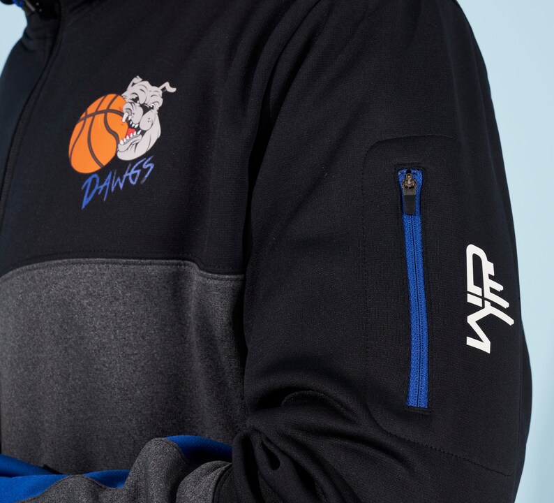 May include: Black and gray color block sweatshirt with a zippered pocket on the sleeve. The sweatshirt has a graphic of a bulldog with a basketball and the text "DAWGS". The sleeve also has a white "NF" logo.