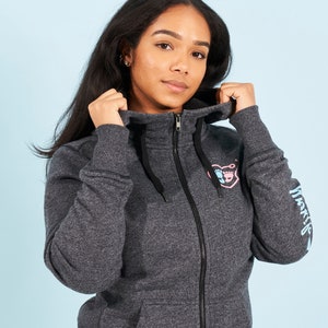 May include: A dark gray hooded sweatshirt with a pink and blue heart design and the word "Momlife" printed on the sleeve.