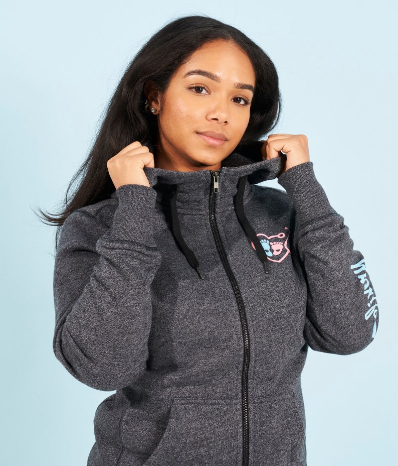 May include: A dark gray hooded sweatshirt with a pink and blue heart design and the word "Momlife" printed on the sleeve.