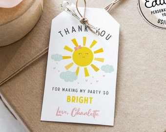 May include: A white thank you tag with a yellow sun with a pink bow and blue clouds. The text on the tag reads "THANK YOU" and "FOR MAKING MY PARTY SO BRIGHT Love, Charlotte".