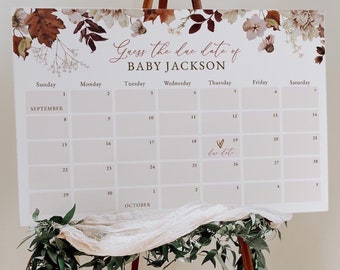 Op de afbeelding: Een witte kalender met een bloemenontwerp en de tekst "Guess the due date of BABY JACKSON". De kalender is ingesteld voor september en oktober en heeft een hart met de tekst "due date" op de 19e.