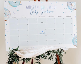 May include: A blue and white donut-themed calendar with the text "Guess the Due Date of Baby Jackson" and a calendar grid with the month of May highlighted. The due date is marked with a blue heart.