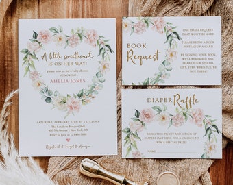 May include: Baby shower invitation set with floral accents. The invitation features a heart-shaped floral wreath with the text "A little sweetheart is on her way!" Additional cards include a book request and diaper raffle. A gold wax seal and stamp are also included.