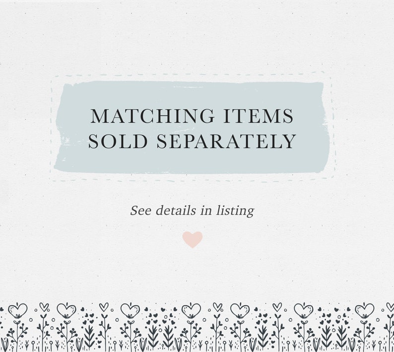 May include: A light blue background with a white border and the text "MATCHING ITEMS SOLD SEPARATELY" in black. Below the text is the phrase "See details in listing" in black. A small pink heart is below the text. A border of black floral designs with small hearts is at the bottom of the image.